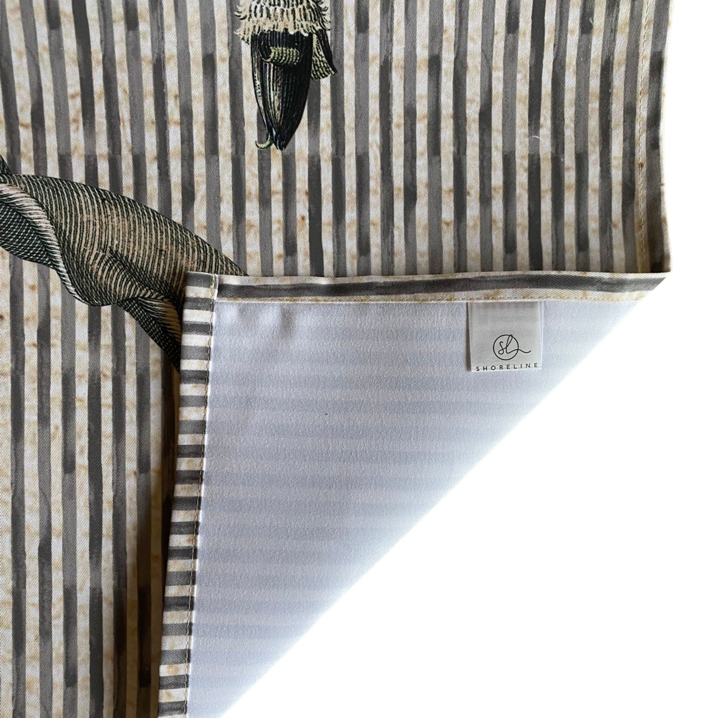 Table runner with a visible brand label on a white background