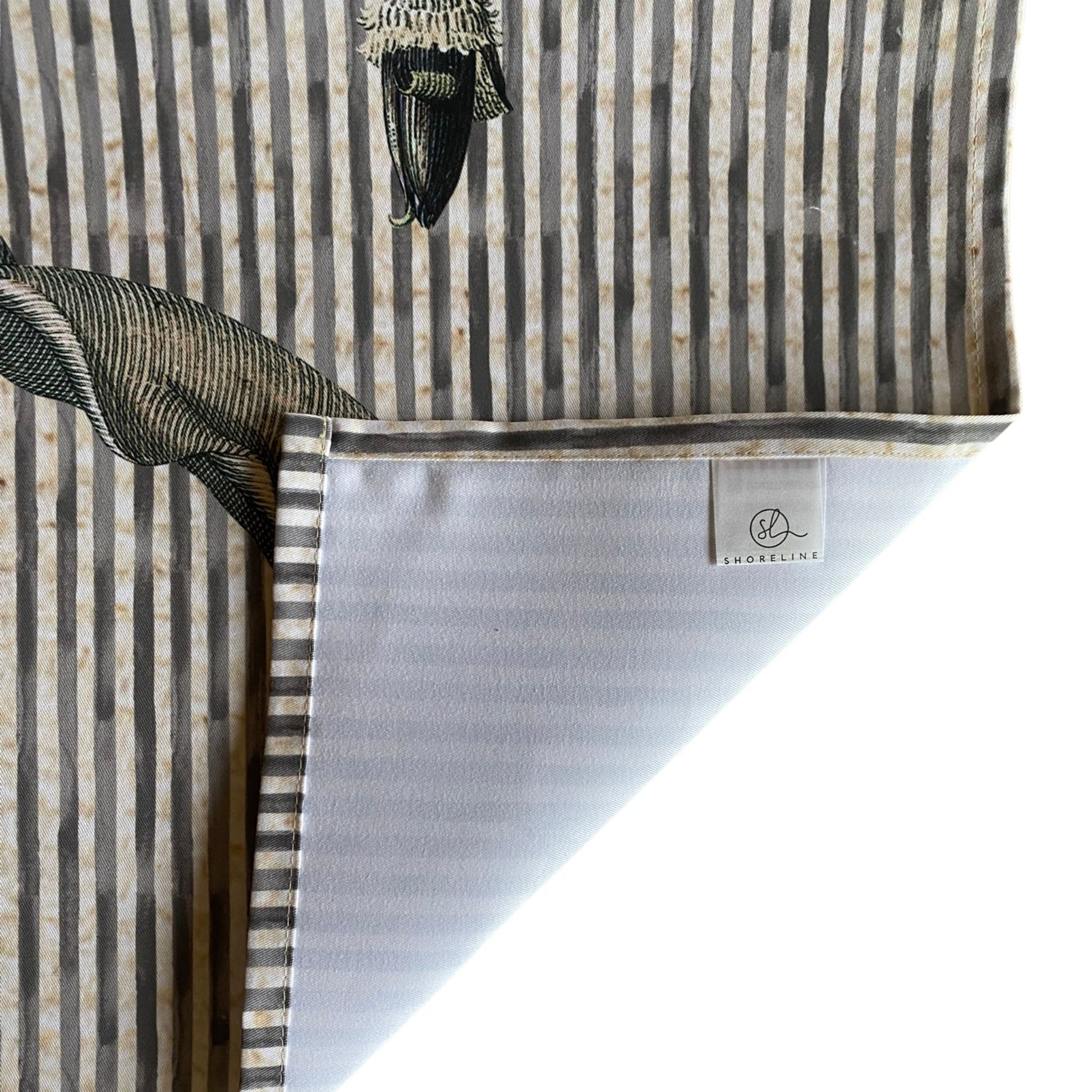 Table runner with a visible brand label on a white background